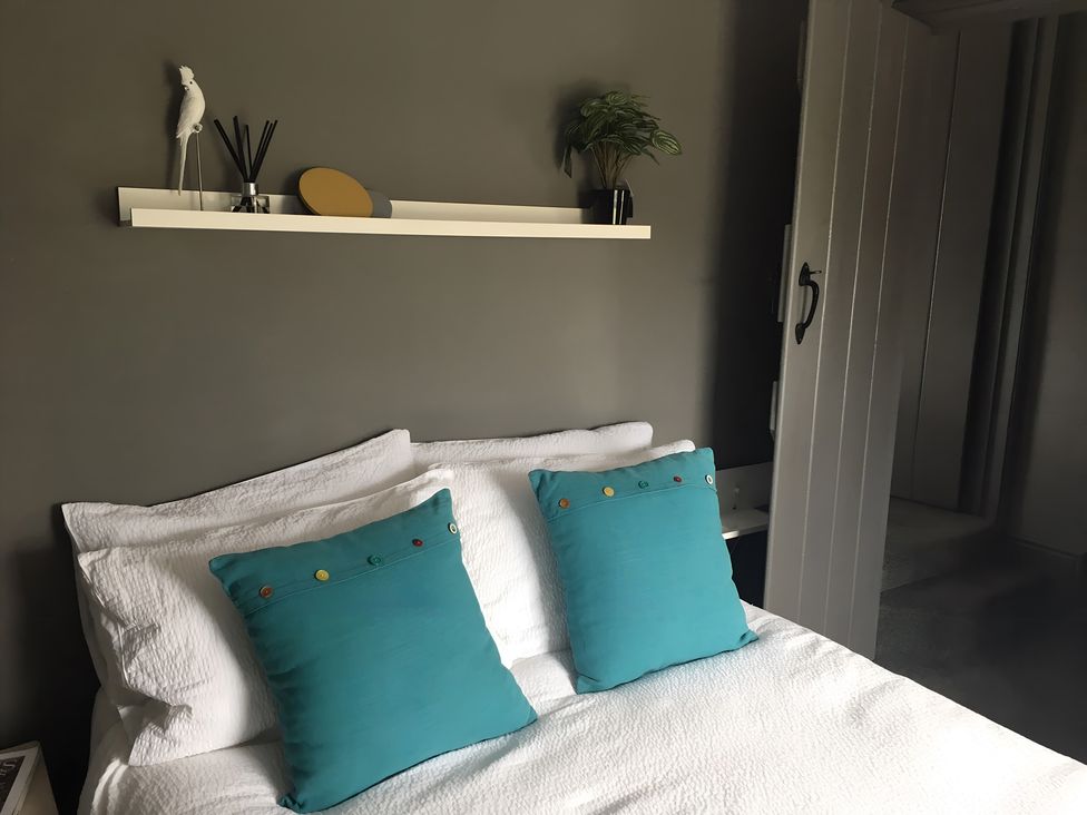 A bedroom with a bed and pillows at 29 Front Street in Market Rasen