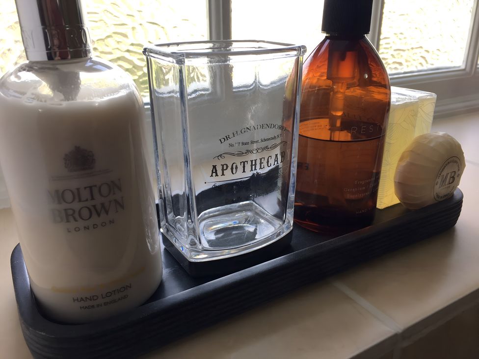 A collection of personal care items on a tray at 29 Front Street Market Rasen