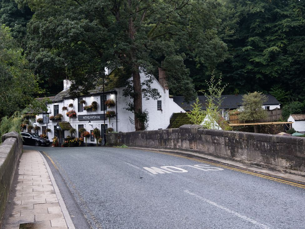 A street view of a building with a sign on the road at Another Shipton Inn in Knaresborough