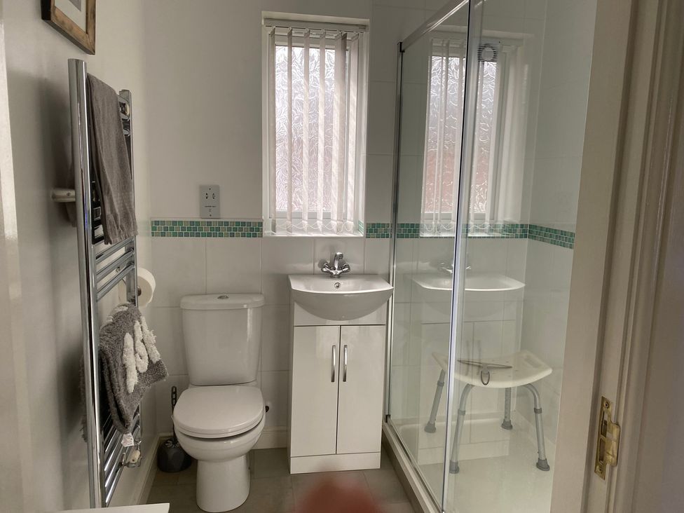 A bathroom with a shower and toilet at 19 Carnaby Mews in Bridlington