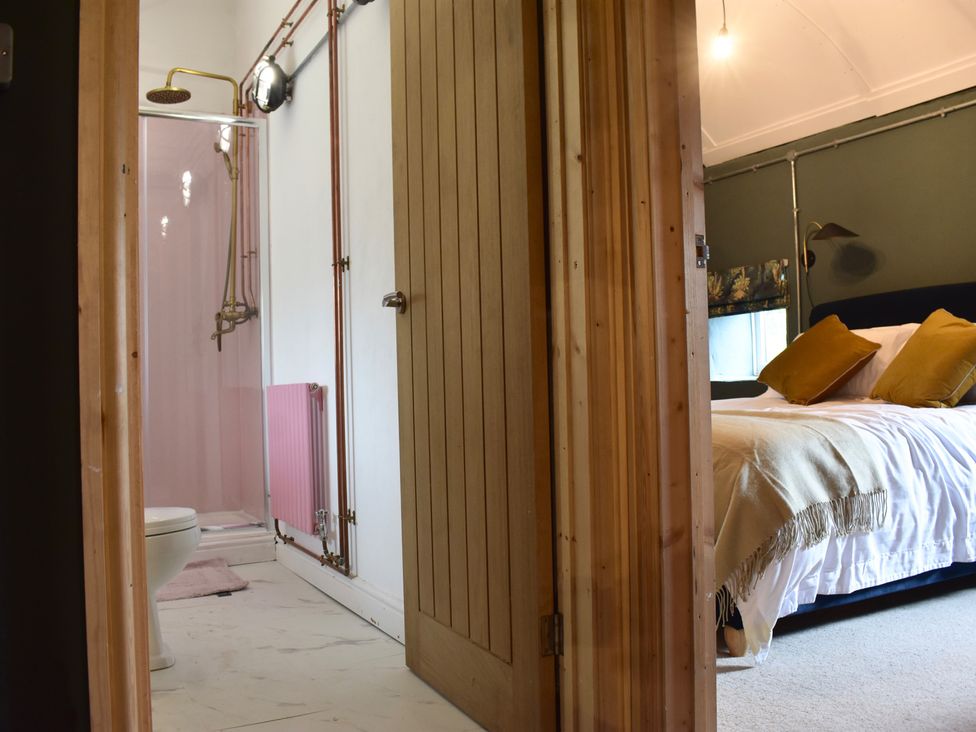 A bathroom with a shower and toilet at Ty Llaeth in Carmarthen