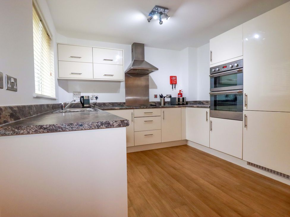 A kitchen with modern appliances and a sink at 21 Greenwix Parc