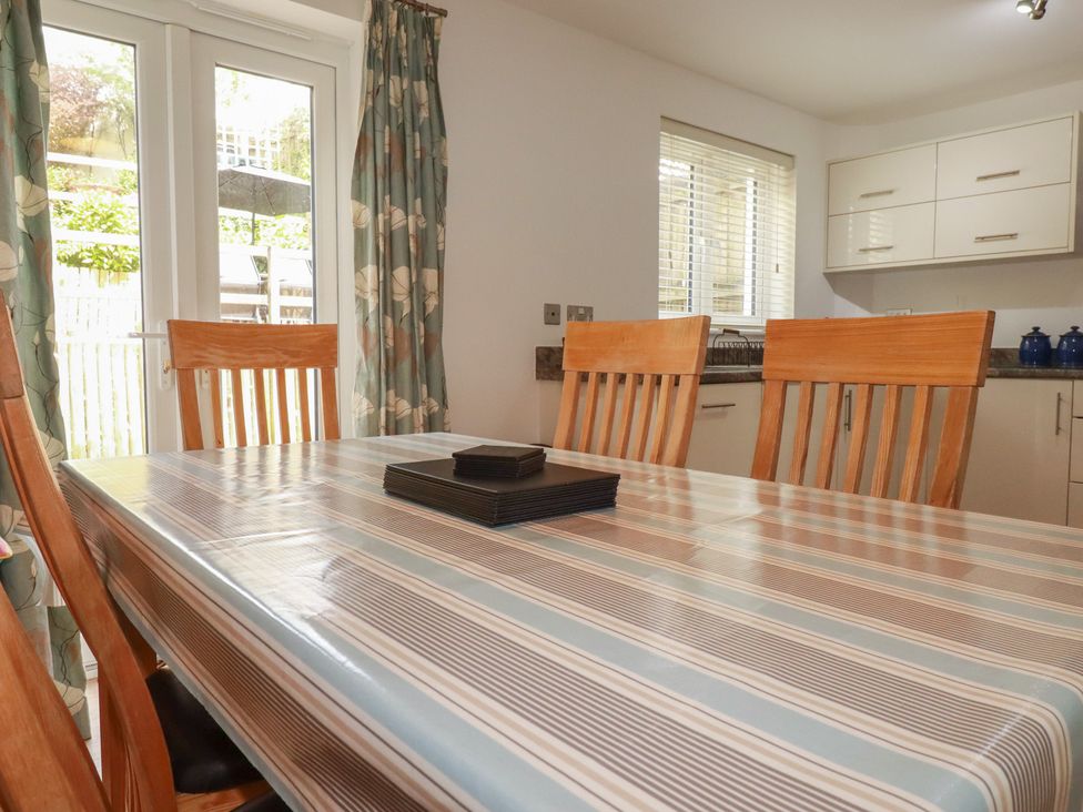 A dining room with a table and chairs at Treveline St Mabyn