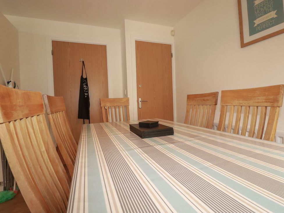 A dining room with a table and chairs at Treveline in St Mabyn