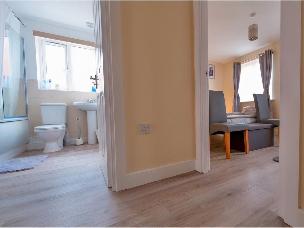 A bathroom with a toilet and sink at Rochester Road in Corby