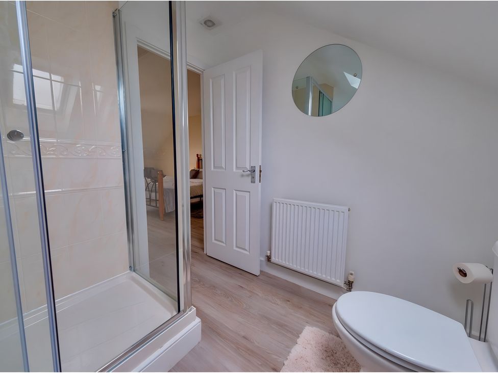 A bathroom with a shower and toilet at Rochester Road in Corby