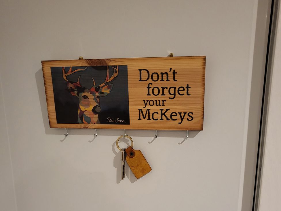 A key holder with hooks and deer artwork at Taigh Nam Moireach Inverness
