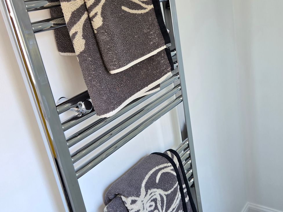 A towel radiator with towels in a bathroom at Taigh Nam Moireach in Inverness