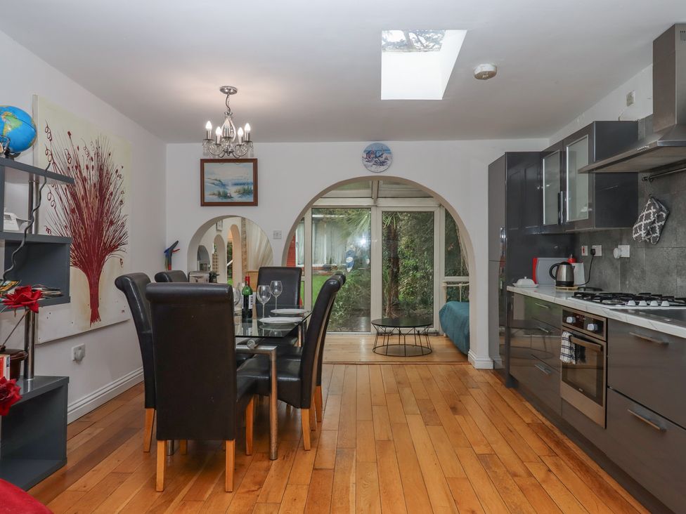 A kitchen with dining table and chairs at Teign Place in Teignmouth