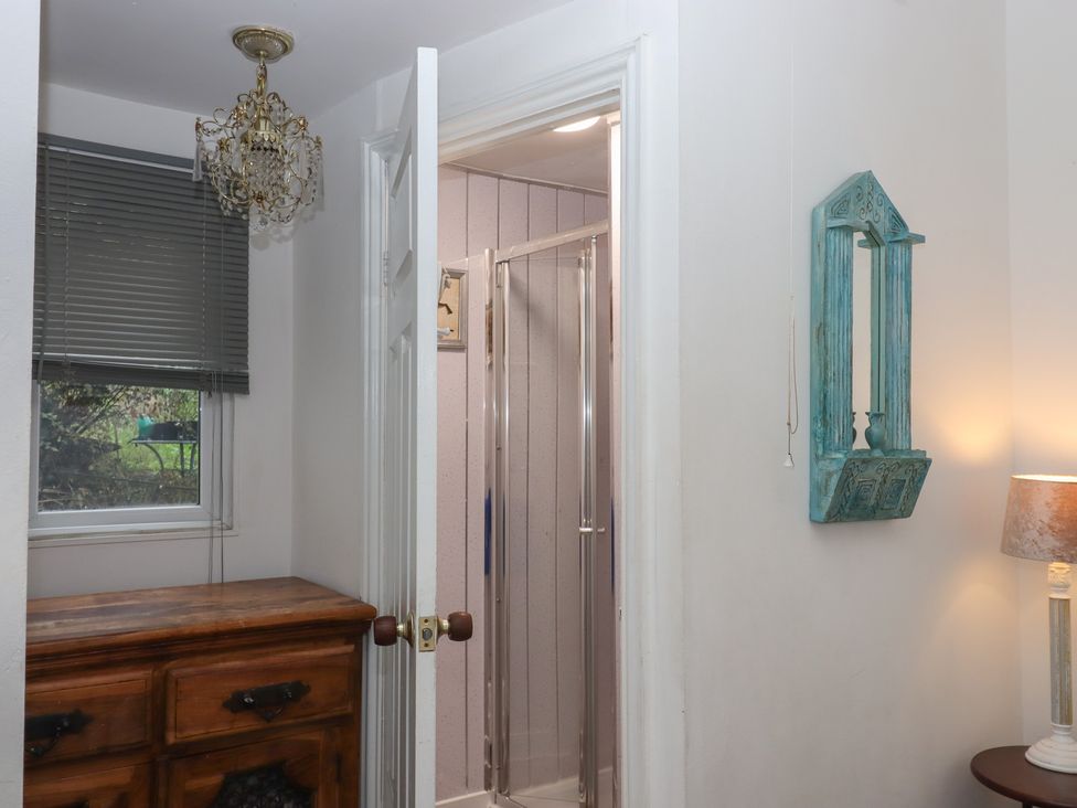 A bathroom with a shower and a drawer at Teign Place Teignmouth