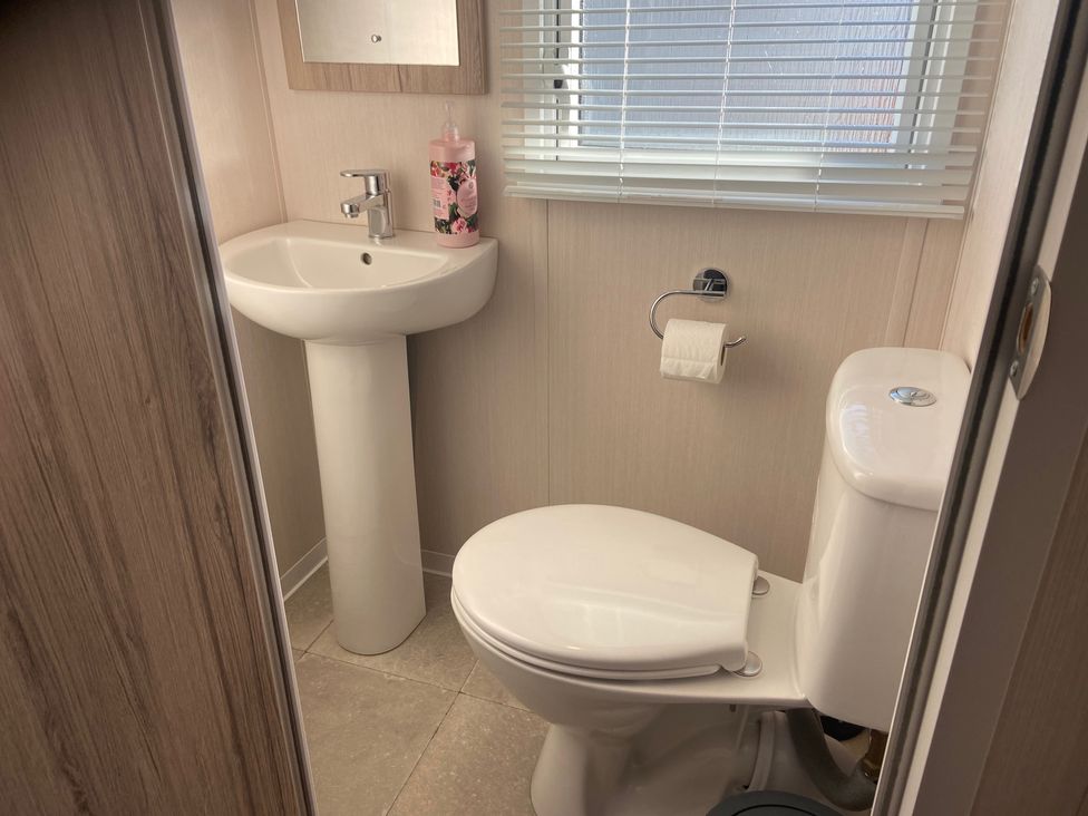 A bathroom with sink and toilet at Elms 32 in Porthcawl
