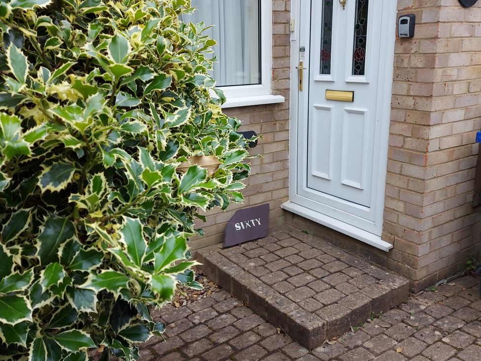 An entrance with a front door and a welcome mat at 60 Pond Bank Northampton