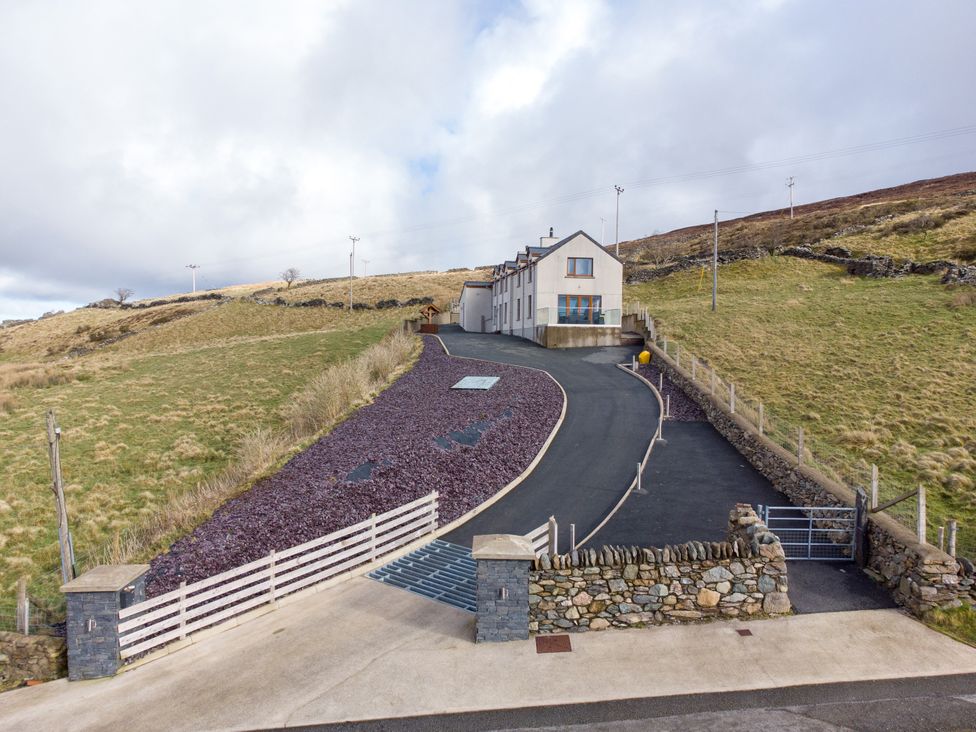A house on a sloped driveway at Groeslon Uchaf in Caernarfon