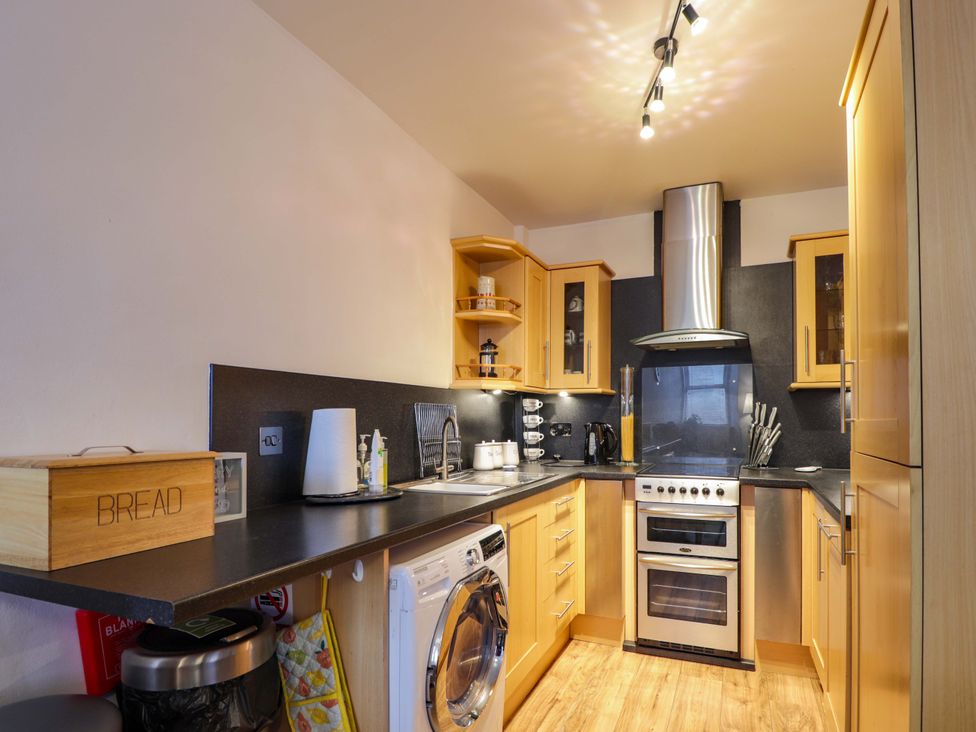 A kitchen featuring an oven, sink, and bread box at 1 Roseneath Terrace Nairn