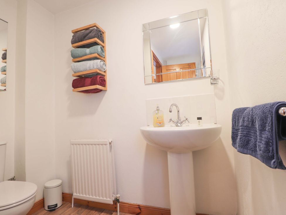 A bathroom with sink and towels at 1 Roseneath Terrace Nairn