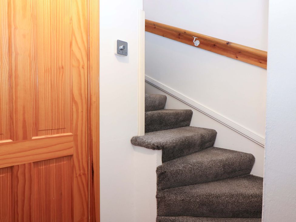 A staircase leading to an upper level at Rose Cottage Nairn
