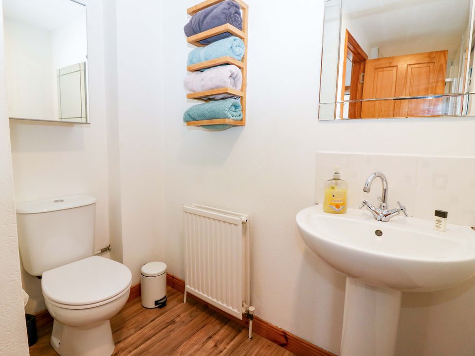 A bathroom with a sink and toilet at Rose Cottage Nairn