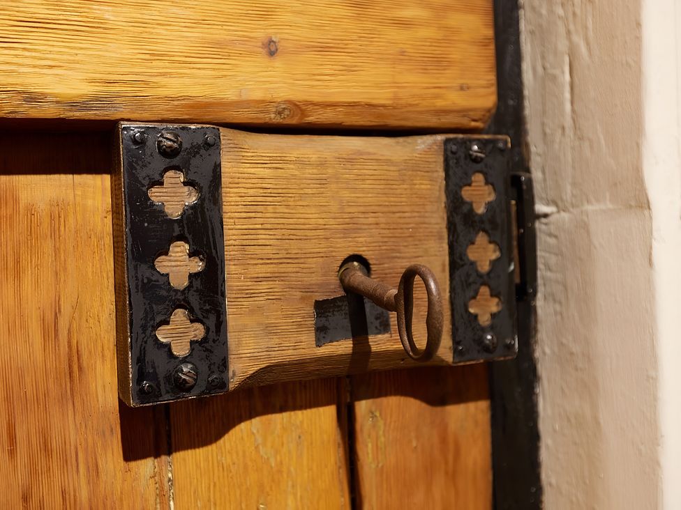 A door with a lock and key installed at Evas Cottage Southam