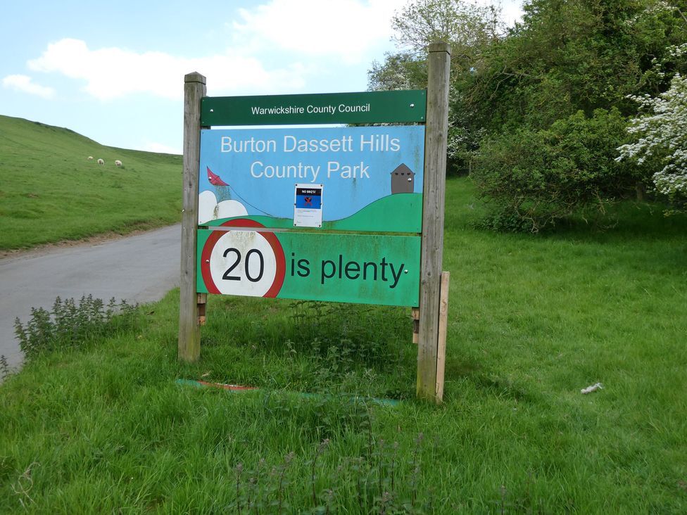 A sign for Burton Dassett Hills Country Park with a speed limit of 20 at Evas Cottage Southam
