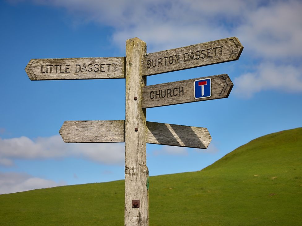 A signpost with directions to Little Dassett, Burton Dassett, and Church