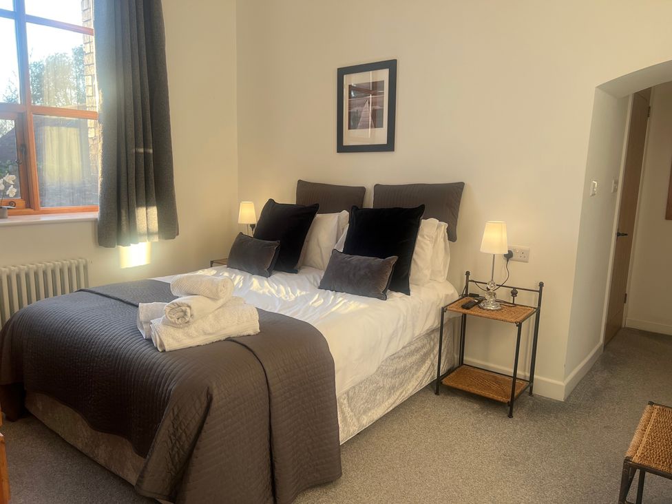 A bedroom with a bed and bedside table at 4 Bickington Road in Barnstaple