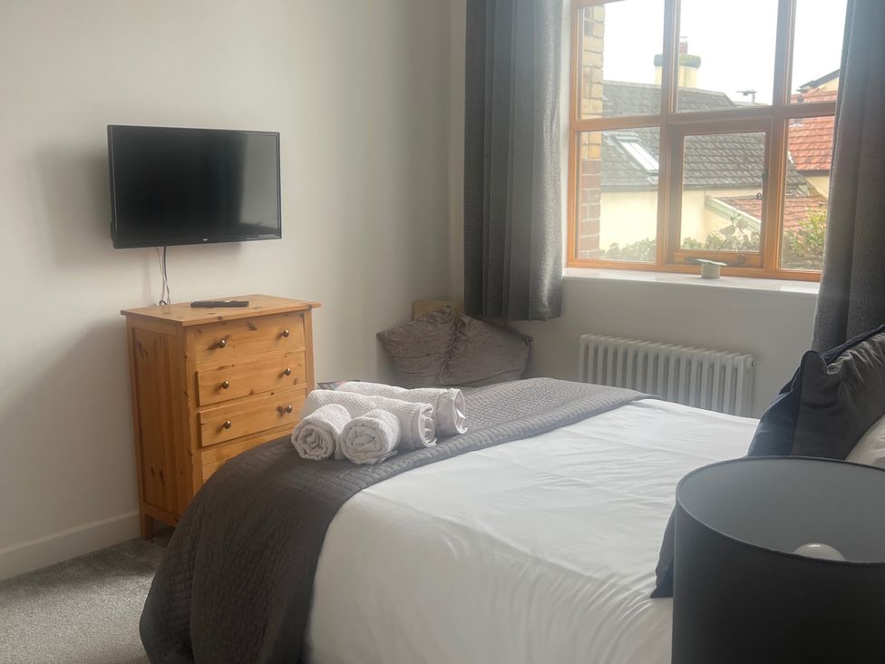 A bedroom with a bed and television at 4 Bickington Road Barnstaple