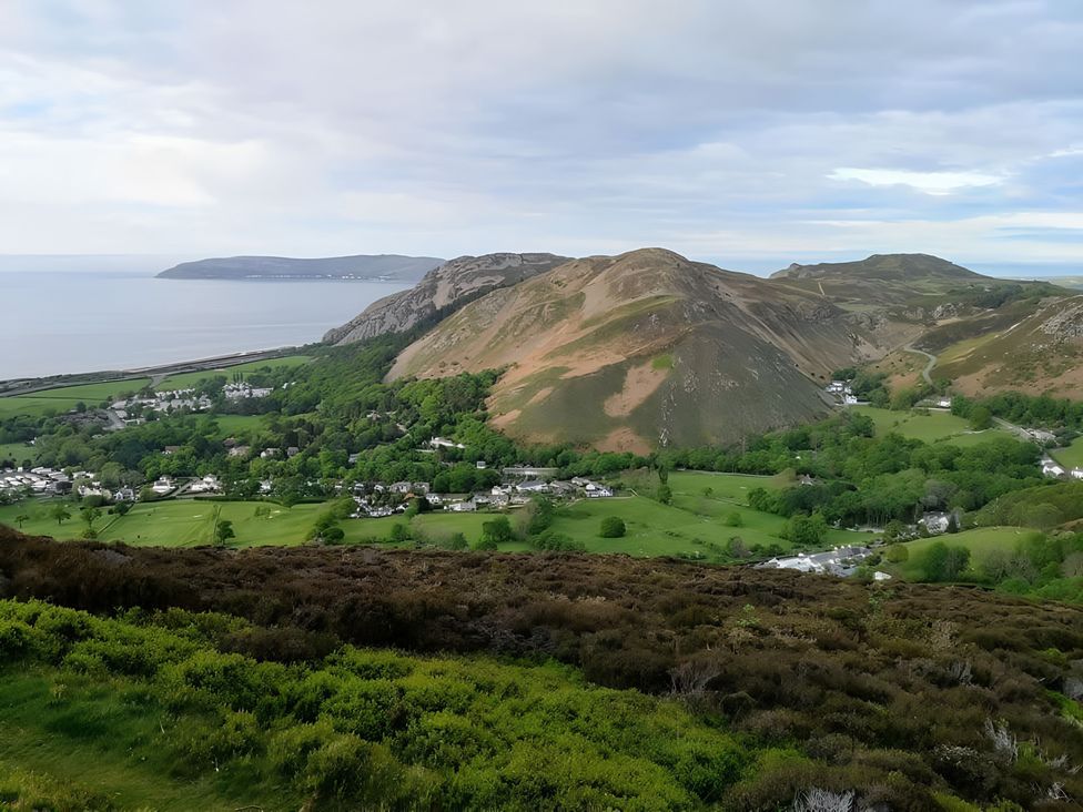 A landscape view of hills and coastline at Blue Haven in Penmaenmawr