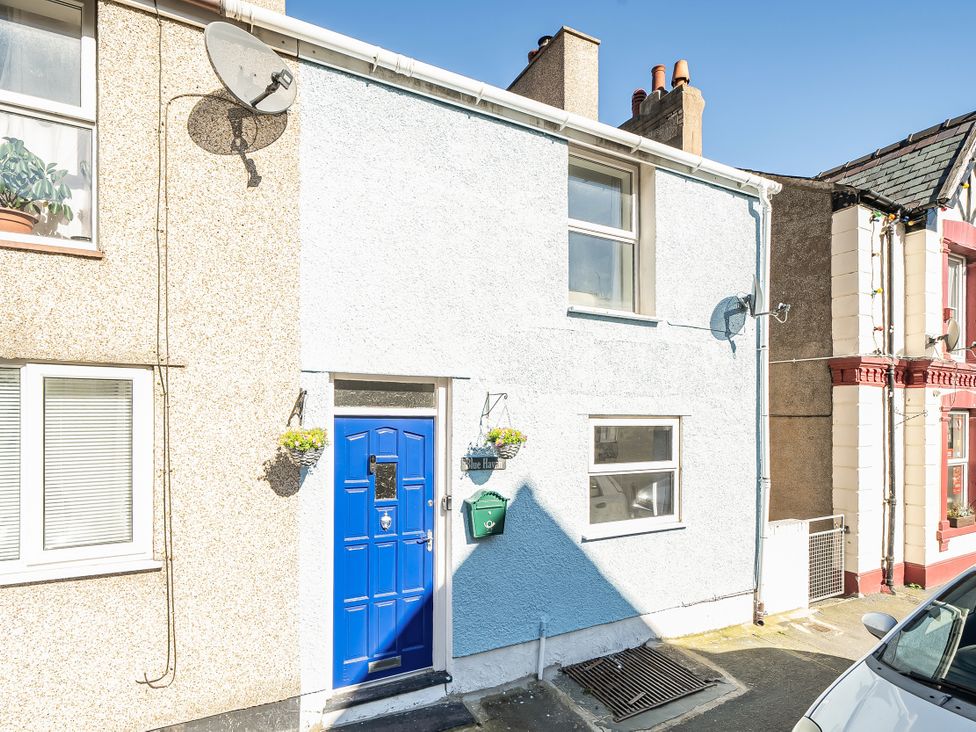 A blue door and windows on a house at Blue Haven in Penmaenmawr