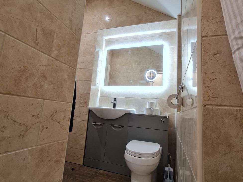 A bathroom with a sink and toilet at Sea View Escape in Penmaenmawr