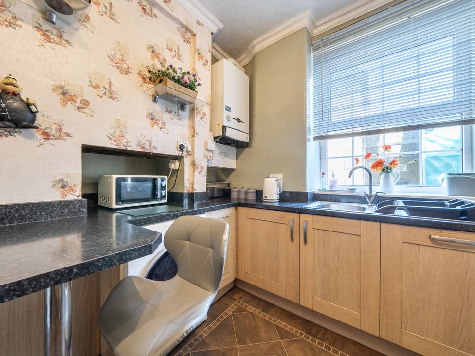 A kitchen with a countertop and microwave at Sea View Escape in Penmaenmawr