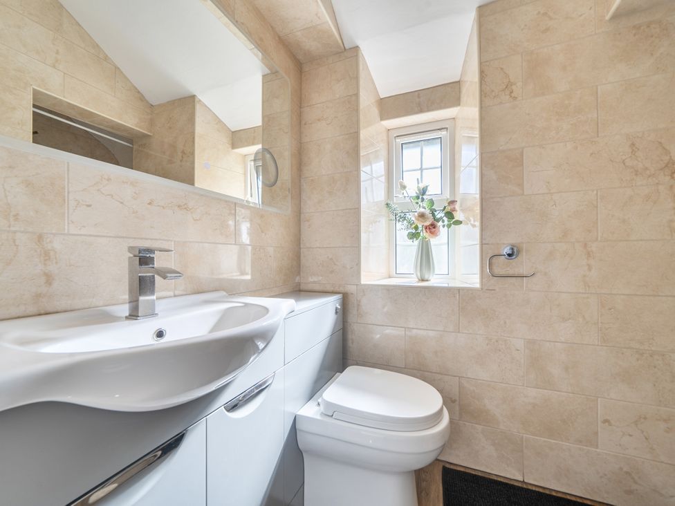 A bathroom with a sink and toilet at Sea View Escape in Penmaenmawr
