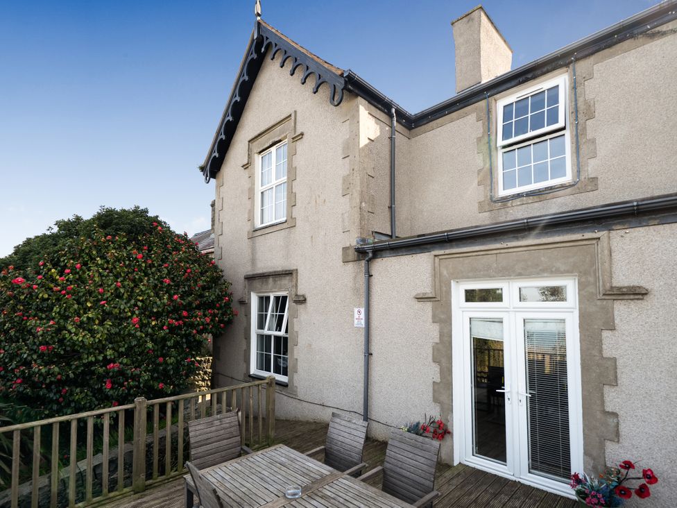 A patio with a table and chairs at Sea View Escape in Penmaenmawr