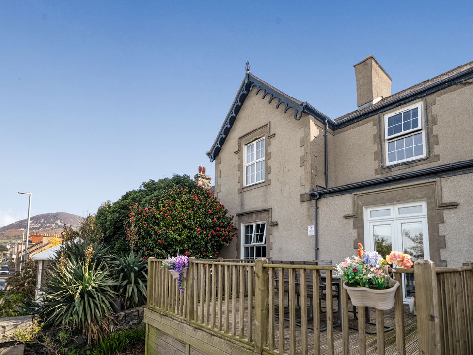A house with a garden and decking area at Sea View Escape in Penmaenmawr