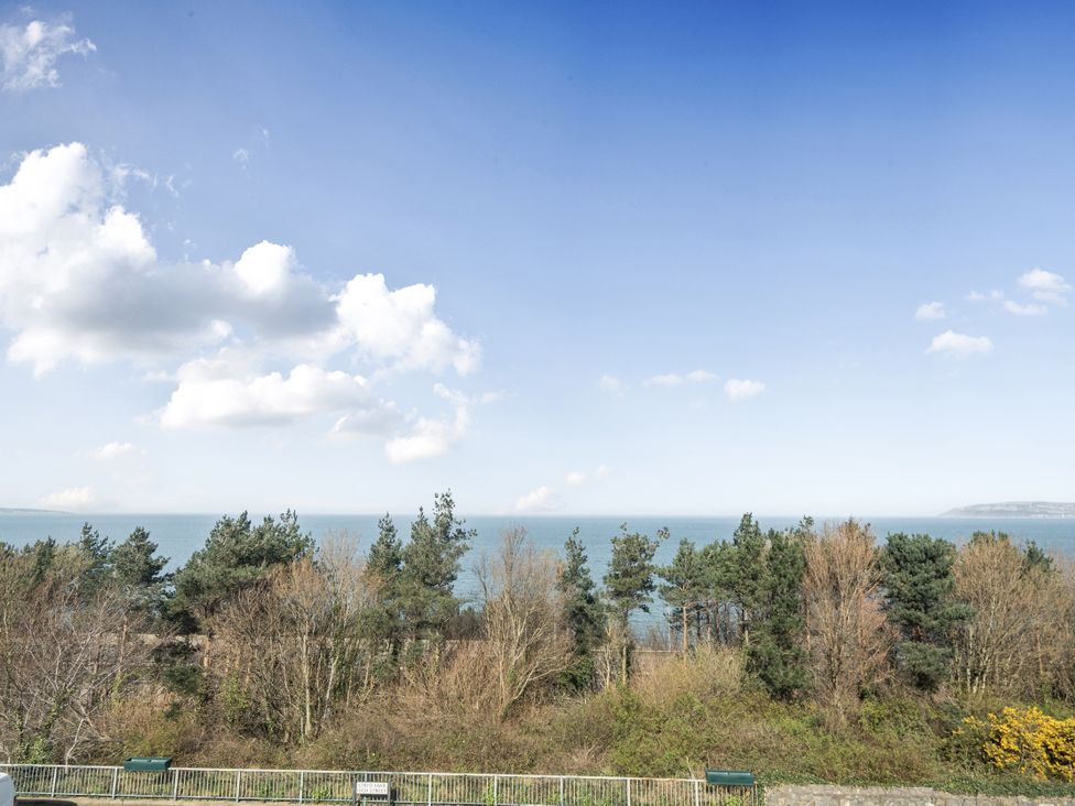 A view of the sea and trees at Sea View Escape in Penmaenmawr