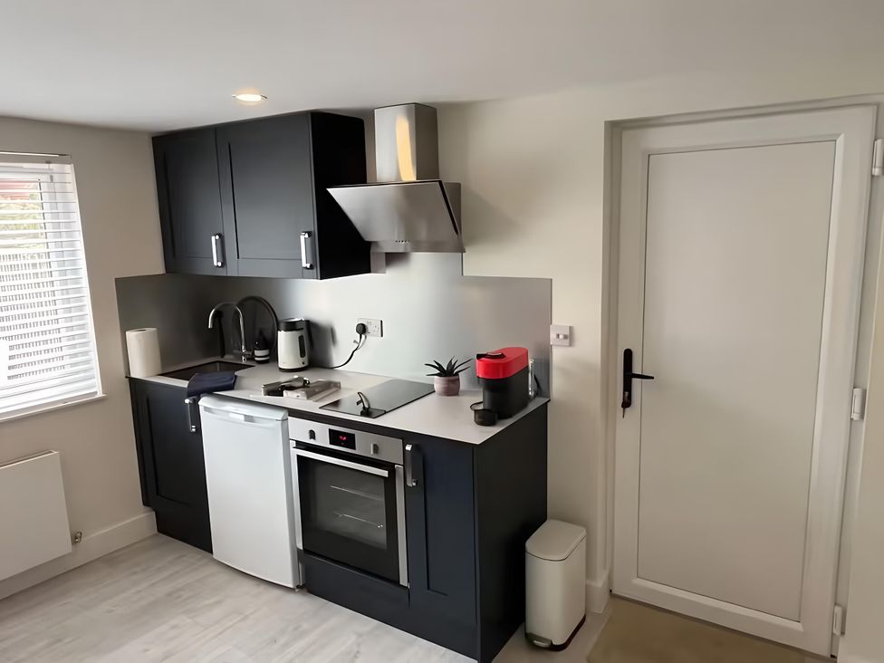 A kitchen with appliances and cabinetry at River Studio in Warsash