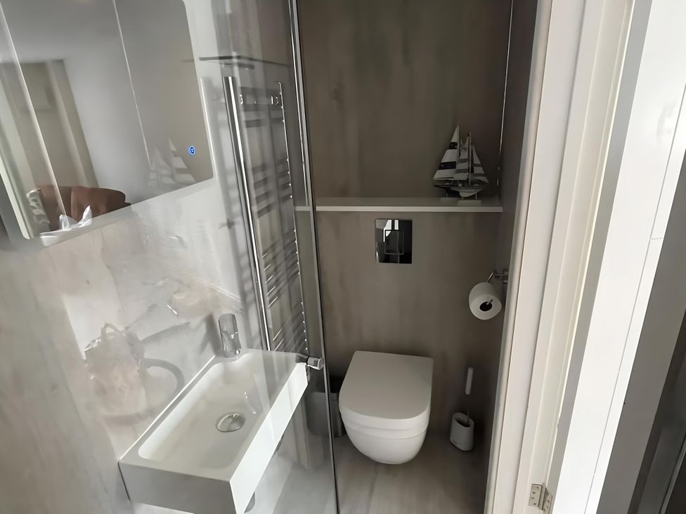 A bathroom with a sink and toilet at River Studio in Warsash