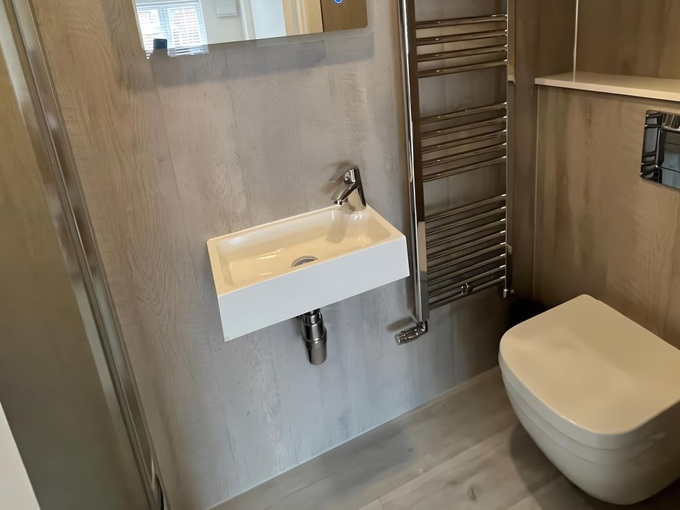 A bathroom with a sink and toilet at River Studio in Warsash