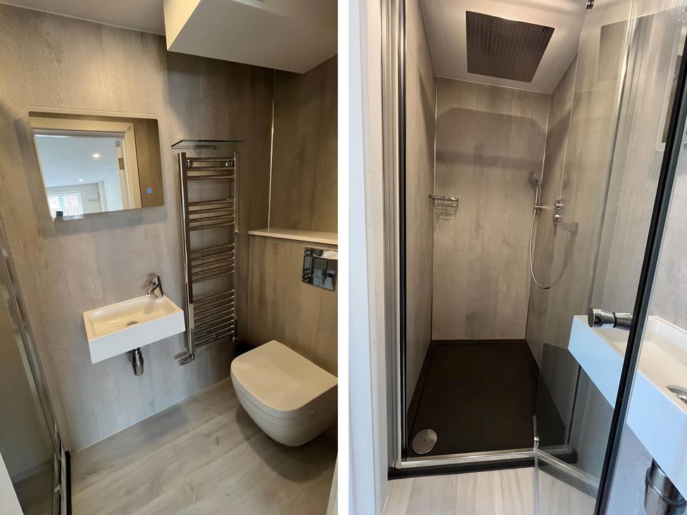 A bathroom with a sink, toilet, shower, towel rail at River Studio in Warsash
