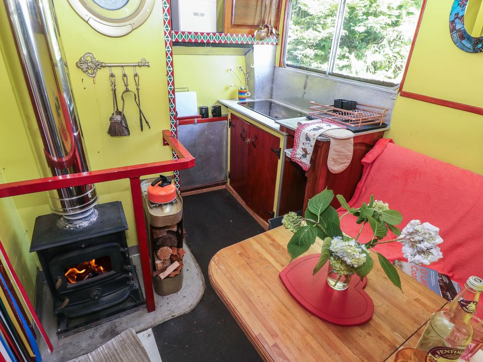 A kitchen with a stove and sink at Rumenco Horse Lorry