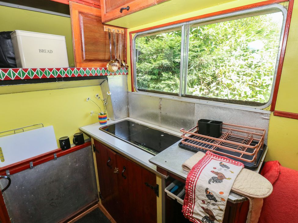 A kitchen with a sink and stove at Rumenco Horse Lorry