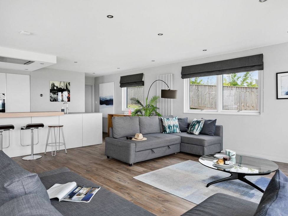A living room with a sofa and coffee table at Huxham View and Annex Stoke Canon