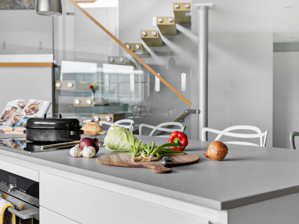 A kitchen with vegetables and a pot on a countertop at Huxham View and Annex Stoke Canon