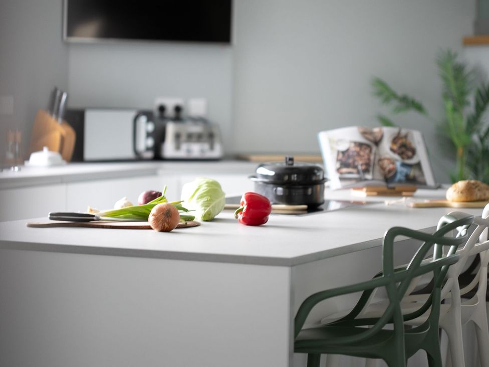 A kitchen with vegetables and kitchenware at Huxham View and Annex Stoke Canon