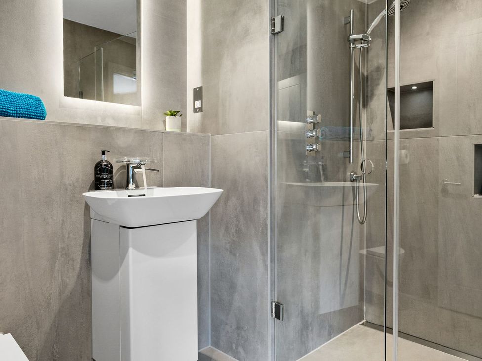 A bathroom with a sink and shower at Huxham View and Annex Stoke Canon