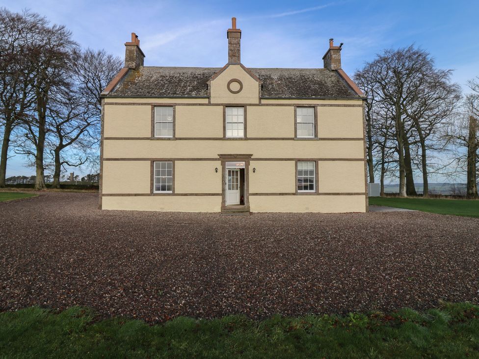 A house with a gravel driveway at Balmashanner Farmhouse Forfar