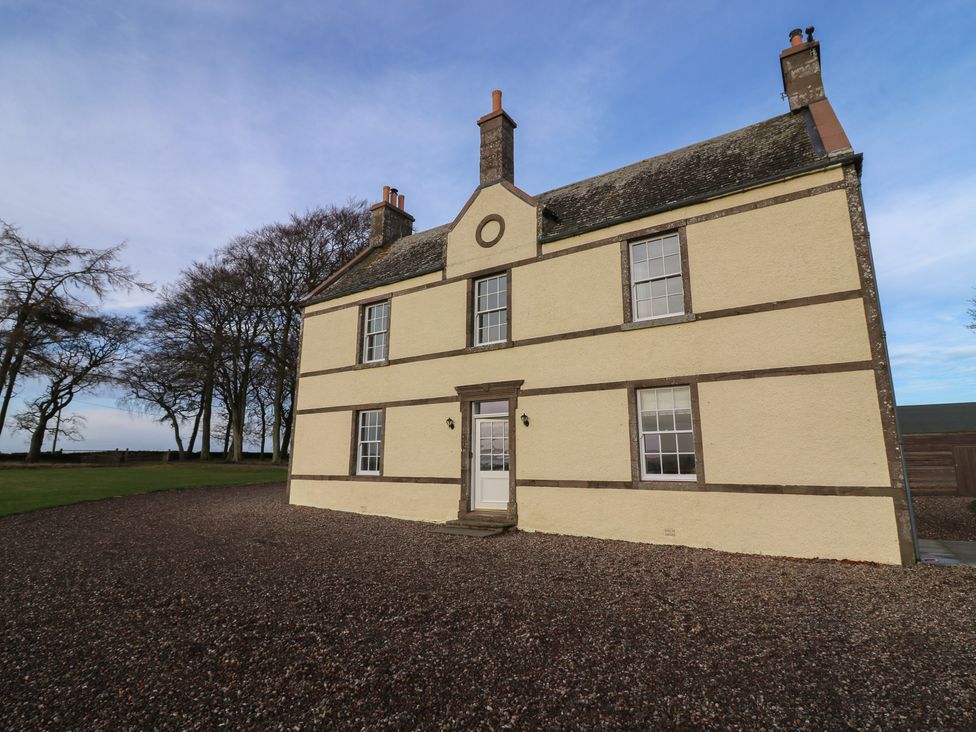 A house with windows and a door at Balmashanner Farmhouse Forfar