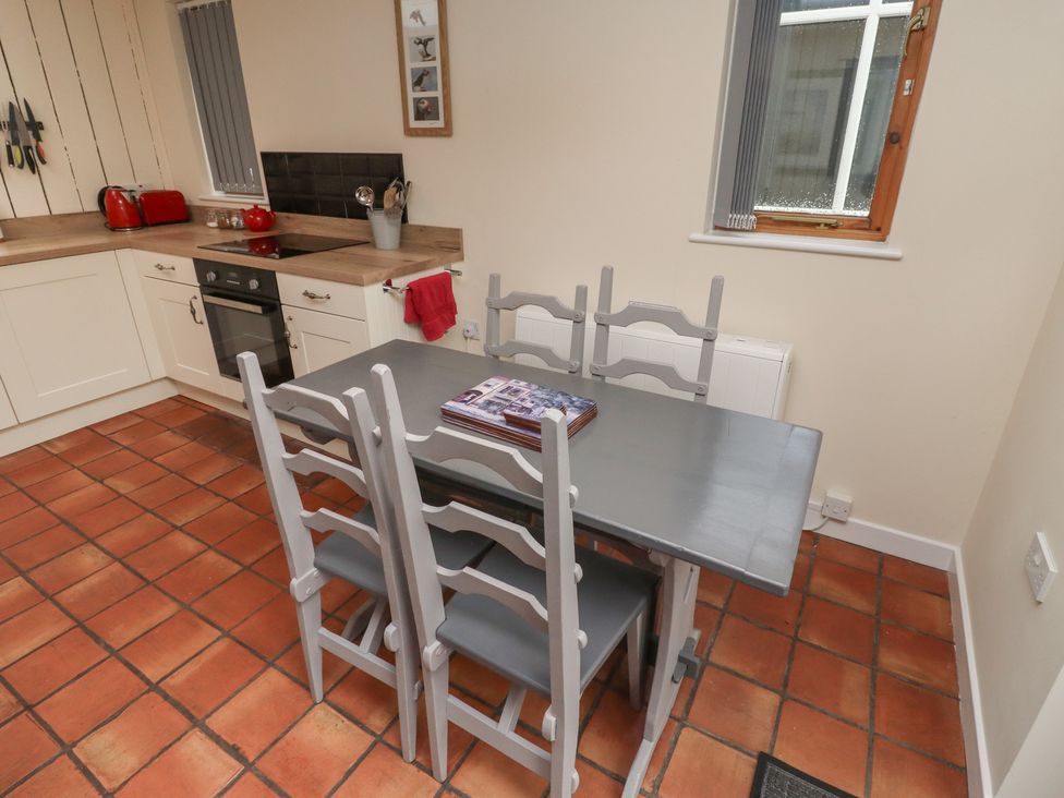 A kitchen with a table and chairs at Sunny Brae in Alnwick