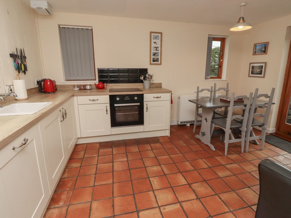 A kitchen with a table and chairs at Sunny Brae in Alnwick