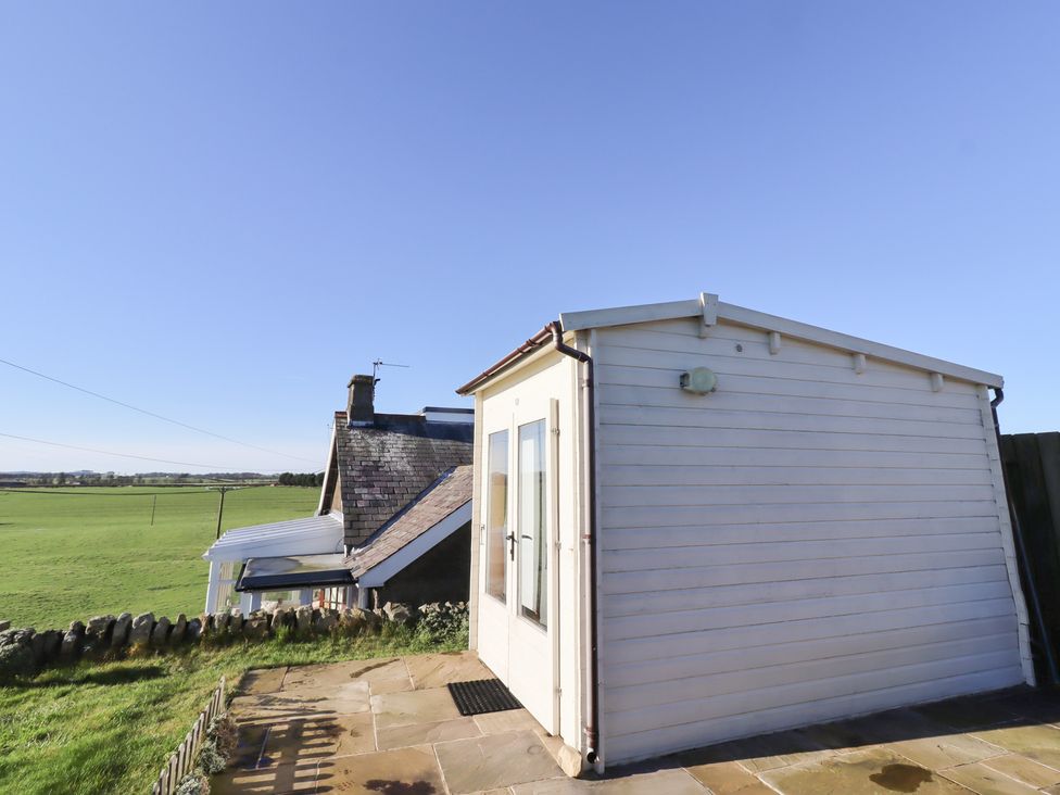 An outdoor view of a building with grass and sky at 2 Sunny Brae in Embleton