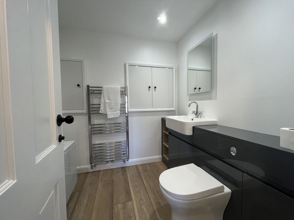 A bathroom with a sink and toilet at Manor Cottage in Ilminster